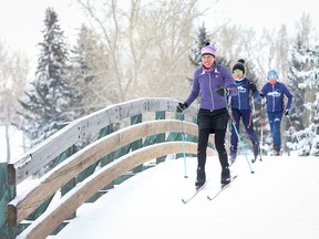 Elise Konoff and her children Justin, 14, and Jenna, 12, enjoy a brisk cross-country ski at Confederation Park Golf Course.  The Konoff family prepares and trains to ski Foothills Nordic Ski Club's own loppet, the Cookie Race.  CHRISTINA RYAN
