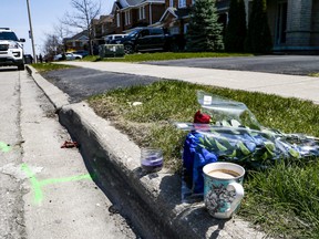 Relatives of a fatal shooting victim leave a full coffee at the scene along with roses.  Peel Police are investigating after a 22-year-old was gunned down in Brampton.