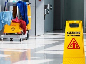 Janitorial and mop bucket on cleaning