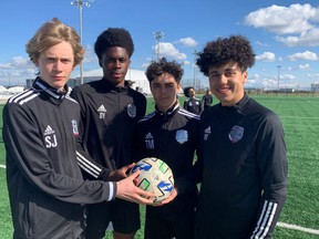 Sebastian, Alex Yesufu, Tommie Macleod, and Kalen Franklin with the North Toronto Nitros youth Soccer club practice on the pitch at Downsview Park.  They have fingers crossed Toronto is selected as a host for World Cup 2026.