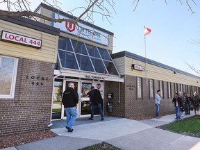 UNIFOR local 444 members make their way into a meeting at the Turner Road hall in Windsor on Thursday, April 21, 2022.