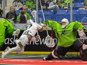 Saskatoon Rush goalie Eric Penney tries to block a shot by Kyle Killen during action against the Vancouver Warriors at SaskTel Center on April 9.