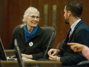Councilor Jean Swanson talks with Councilor Michael Wiebe in 2018.