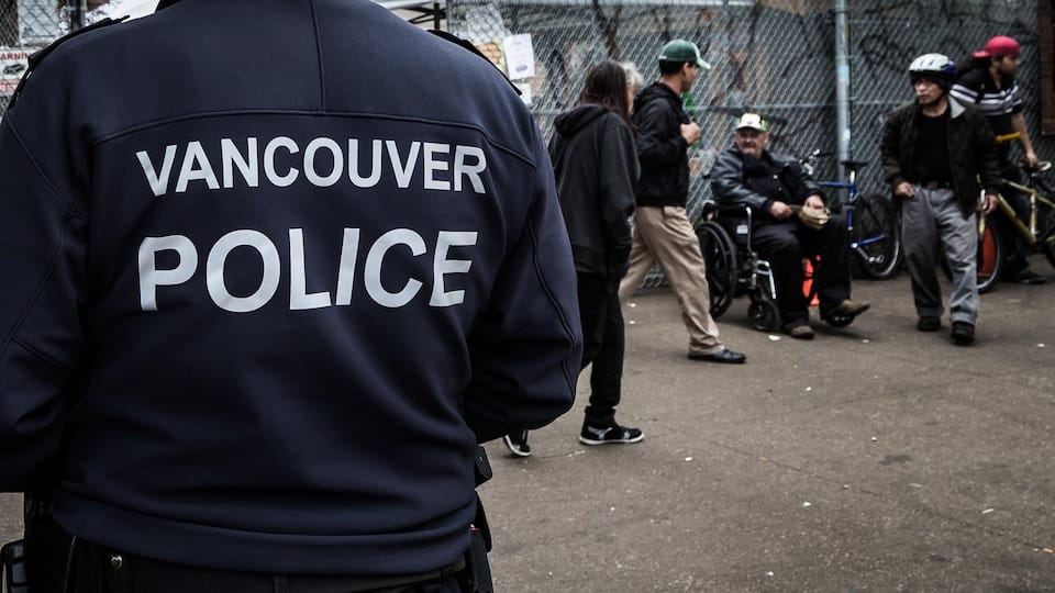 A Vancouver police officer patrols the Downtown Eastside.