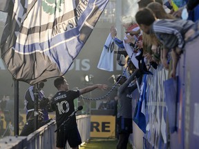 CF Montréal midfielder Joaquin Torres rings the 1642 supporters bell after the win against Atlanta United FC at Saputo Stadium on Saturday, April 30, 2022.