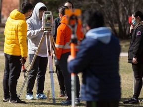 Civil Engineering students work on a surveying course in the University of Alberta quad, in Edmonton Friday, April 29, 2022. Photo By David Bloom