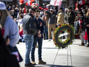 Neil Sheard, the organizer of the ‘Rolling Thunder’ motorcycle ride and ceremony Saturday at the National War Memorial, and Christopher Deering, spoke at the ceremony. ASHLEY FRASER/Postmedia.