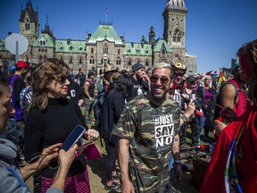 Chris Sky, an anti-vaccine, anti-mandate activist, on Parliament Hill Saturday afternoon greeting supporters before he spoke to the crowd. ASHLEY FRASER, POSTMEDIA