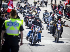 The ‘Rolling Thunder’ Ottawa motorcycle rally made their way through downtown Ottawa on a controlled route along Elgin Street Saturday, April 30, 2022.
