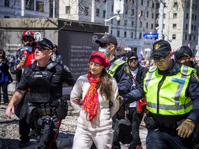One person was arrested during the 'Rolling Thunder' Ottawa rally downtown Ottawa, Saturday, April 30, 2022. Ottawa Police walked her down Elgin Street, straight to the court house.