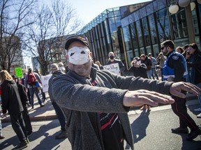 A man walked around prior to the event with a mask with eyes cut out.