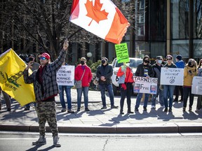 Counter protesters were out for the 'Rolling Thunder' Ottawa ceremony at the National War Memorial downtown Ottawa, Saturday, April 30, 2022.