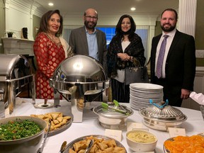 Alberta's Lt. Gov.  Salma Lakhani (left) recognized a gift of $42,000 to Edmonton's Food Bank from Edmonton's Muslim community for hosting a small Iftar gathering at her government residence on her Friday night.  Iftar marks Muslims breaking their fast at the end of Ramadan. With her are (l to r) Iqbal Wattoo, chair of the Edmonton Council of Muslim Communities (ECMC), Yasmeen Nizam, ECMC vice-chair, and Edmonton Food Bank's Shawn Parchoma.  (photo: Janet Resta)