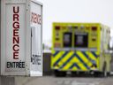 One of 5 ambulances parked at the emergency room at the Notre-Dame Hospital in Montreal, on Jan. 13, 2022.