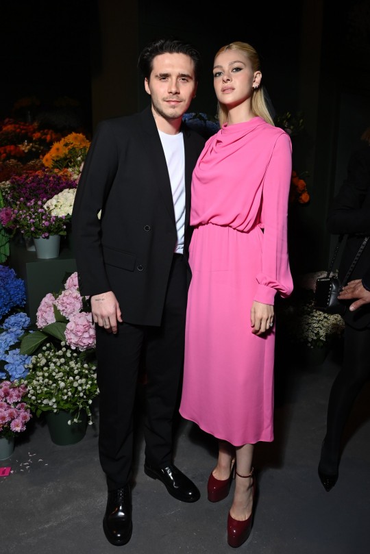 PARIS, FRANCE - OCTOBER 1: (EDITORIAL USE ONLY - For Non-Editorial Use, Request Fashion House Approval) Brooklyn Beckham and Nicola Peltz attend the Valentino Womenswear Spring/Summer 2022 show as part of Paris Fashion Week on October 1, 2021 in Paris, France.  (Photo by Pascal Le Segretain/Getty Images)