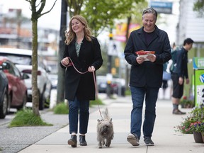 Jeanette Ashe with her husband Kennedy Stewart and dog Fergus on Dunbar Street in Vancouver on Saturday, April 30, 2022. Ashe was the BC NDP candidate in the Vancouver-Quilchena byelection.
