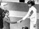 Soviet Gymnast Olga Korbut congratulates her Romanian counterpart Nadia Comaneci on the podium at the Montreal Forum during the 1976 Summer Olympic games in Montreal.  Comaneci had just won the gold medal in the balance beam competition where she received a perfect 10 from the judges.  Korbut scored 9.9 winning the silver medal.
