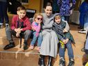 Angelina Jolie poses for a picture with children in Lviv, Ukraine April 30, 2022. 