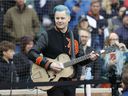 Jack White performs the US national anthem before a game between the Detroit Tigers and the Chicago White Sox on Friday, April 8, 2022.