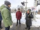 Neighborhood residents Ronald Daignault and Chantal Laurin voice their concerns to CDPQ Infra spokesperson Jean-Vincent Lacroix, left, after a media briefing on the REM de l'Est in Montreal on Tuesday January 25, 2022.