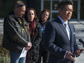 The family of murder victim Shana Harris Morris stand behind IHIT spokesperson Sgt. Frank Jang at a press conference in Surrey, BC Tuesday, April 13, 2021. The family are (from left to right) uncle Ryan Morris, sister Paige Harris and mom Kerry Morris.