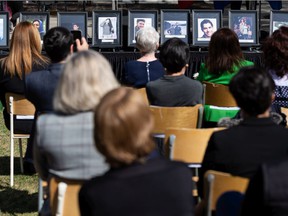 Portraits of the lost are seen during the unveiling of a new memorial site on campus in honor of the ten members of the University's community and the three members of their families who were among the 176 people killed in the downing of Flight PS752 at the University of Alberta in Edmonton, on Tuesday, May 3, 2022. Photo by Ian Kucerak