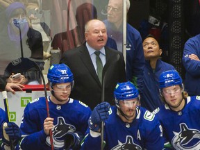 New Canucks head coach Bruce Boudreau in his debut behind the team bench on Dec. 6, 2021 against the Los Angeles Kings at Rogers Arena.