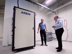 “An ecosystem that knows how to innovate.”  Bill Van Heyst, left, dean of the University of Windsor's Faculty of Engineering, and Peter Frise, director of the Center for Automotive Research and Education, and are shown in a battery test lab at the school on Tuesday, May 3, 2022.
