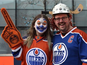 Gord McQueen with his daughter Brooklyn, 13, decked out in Oilers attire joining fans at the tailgate party in the ICE district Plaza prior to the start of the Oilers game two against the LA Kings in Edmonton, May 4, 2022. Ed Kaiser/Postmedia