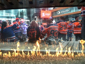 A gas flame burns as fans attend the tailgate party in the ICE district Plaza prior to the start of the Oilers game two against the LA Kings in Edmonton, May 4, 2022. Ed Kaiser/Postmedia