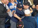 A young Yankees fan cries tears of joy after a Blue Jays fan gives him an Aaron Judge home run ball during the Yankees-Blue Jays game at Rogers Center on Tuesday, May 3, 2022.
