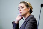Amber Heard listens in the courtroom at the Fairfax County Circuit Court in Fairfax, Va., on May 2, 2022.  