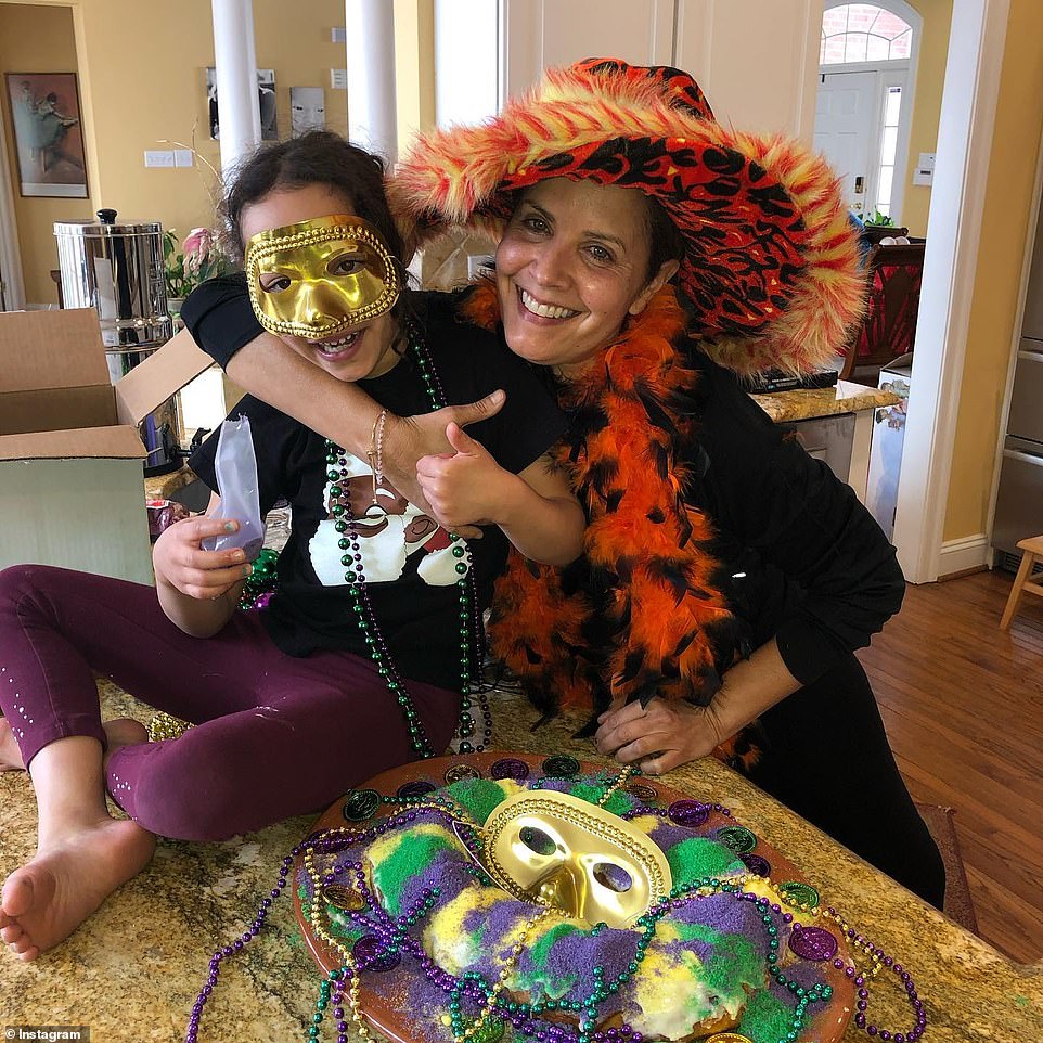 Malveaux is pictured with her daughter, Soleil, who was born in 2014. The couple is seen celebrating Mardi Gras.