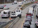 Motorists line up to access the Champlain Bridge as buses enter the reserved bus lane during rush hour in this file photo,