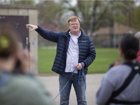 With dog Izzy on the leash, Frazier Fathers leads a Jane's Walk through their Marlborough neighborhood of West Windsor on Friday.  Many urban topics in many other spots in Windsor and Amherstburg will be explored over the weekend during this year's Jane's Walk Festival.