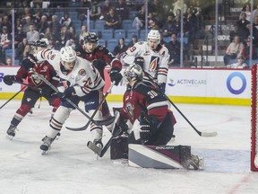 Vancouver Giants goalie Jesper Vikman stops Kamloops Blazers Daylan Kuelfer during the first period of the WHL playoff series Game 1 at the Sandman Center in Kamloops May 6, 2022.