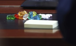 A pile of gummy bears and other candy sits on a table in front of actor Johnny Depp in the courtroom at the Fairfax County Circuit Court in Fairfax, Va., Thursday, May 5, 2022.