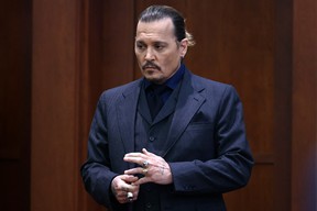 Johnny Depp stands during a break in his defamation trial against his ex-wife Amber Heard, at the Fairfax County Circuit Courthouse in Virginia.