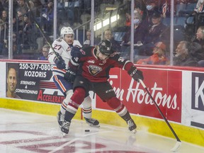 Kamloops Blazers Mats Lindgren battles Vancouver Giants Justin Lies during Game 2 of the WHL playoff series at the Sandman Center in Kamloops May 7, 2022. Allen Douglas