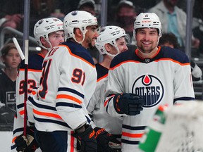 Edmonton Oilers center Ryan Nugent-Hopkins (93), left wing Evander Kane (91) and defenseman Cody Ceci (5) celebrate after a goal against the LA Kings in the third period of game three of the first round of the 2022 Stanley Cup Playoffs at Crypto.com Arena.