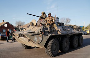 Service members of pro-Russian troops are seen atop of an armored personnel carrier during Ukraine-Russia conflict in the village of Bezimenne in the Donetsk region, Ukraine May 7, 2022.