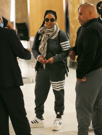 New York, NY - *EXCLUSIVE* - A smiling Janet Jackson is in a good mood as she flies out of New York's JFK airport.  Pictured: Janet Jackson BACKGRID USA MAY 8, 2022 BYLINE MUST READ: T.JACKSON / BACKGRID USA: +1 310 798 9111 / usasales@backgrid.com UK: +44 208 344 2007 / uksales@backgrid.com *Customers from UK - Images containing Children must pixelate face before publication*