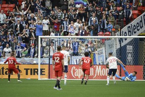 Vancouver Whitecaps goalkeeper Thomas Hasal (1) makes a save against a penalty shot by Toronto FC midfielder Alejandro Pozuelo (10) during the first half at BC Place.