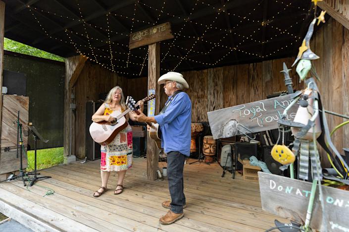 Maggie and Mike McKinney, both musicians, have a small stage and shelter for people to watch musical concerts on their property.  They were at a folk music festival when they first heard that the storm was approaching in the Gulf.
