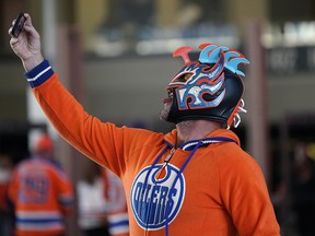 An Edmonton Oiler fan takes a selfie inside Rogers Place during game four of the Oiler's first-round Stanley Cup playoff championship against the Los Angeles Kings, which was played in Los Angeles on Sunday, May 8, 2022.