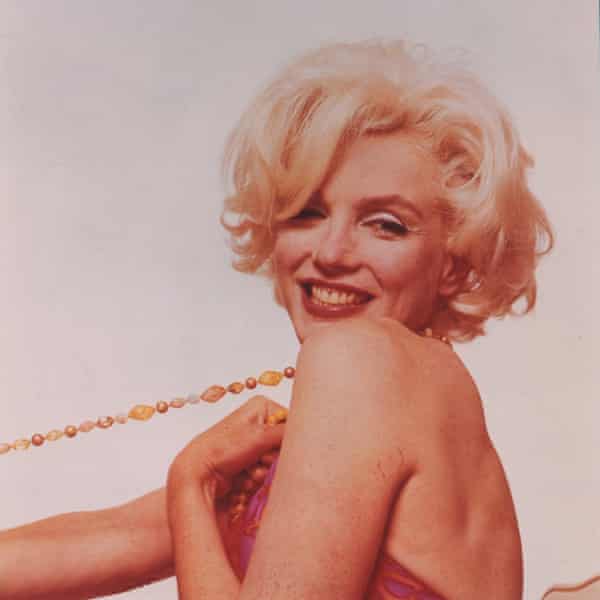 A rose tinted 1962 photograph by Bert Stern of Marilyn Monroe.