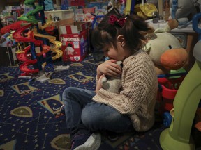 Yasmin El Hilali clutches a stuffed animal at the Ukrainian Newcomers' Centre.