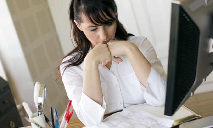 Frustrated woman using computer