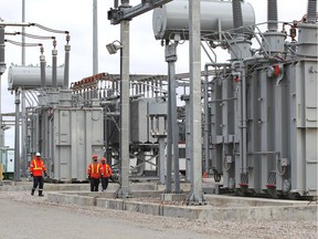 Crews walk through the massive Leamington Transmission Station built by Hydro One and Independent Electricity System Operator on Road 6 in Leamington in November 2019. The project aims to support the growth of the greenhouse industry along with other sectors including housing.