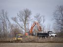 Heavy machinery begins work on a 72-dwelling subdivision in Harrow, on Monday, March 15, 2021. The subdivision is located off County Road 13, south of Pollard Drive.